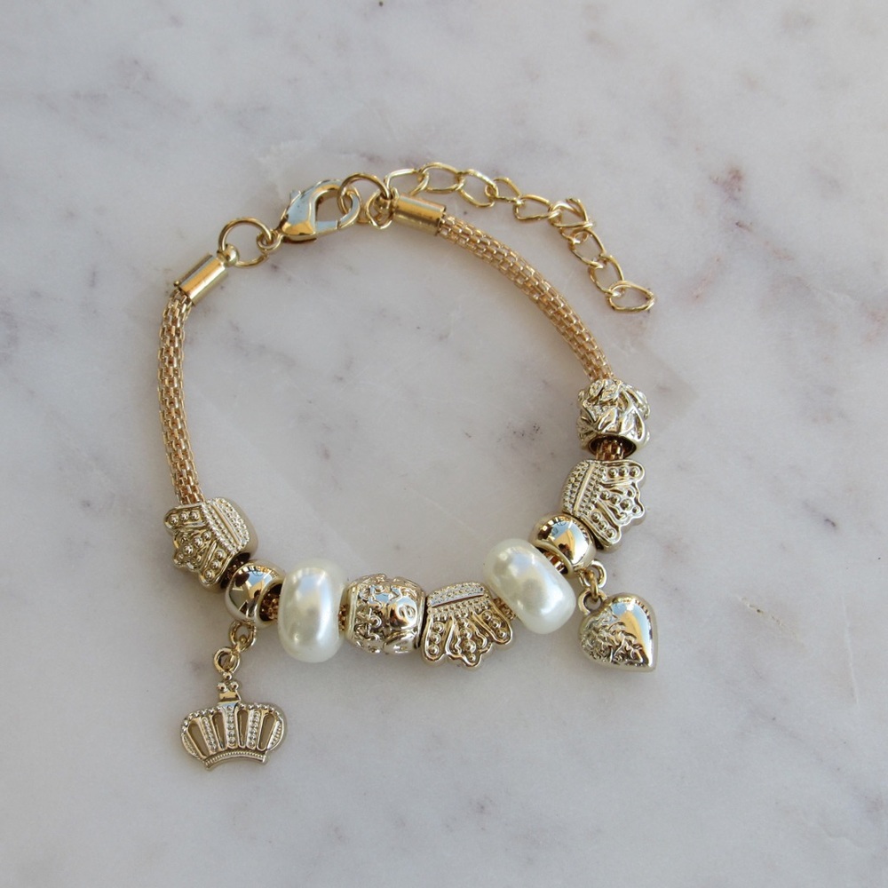 Gold bracelet with charms